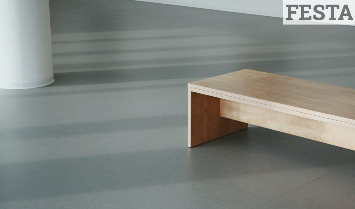 brown wooden table on gray floor