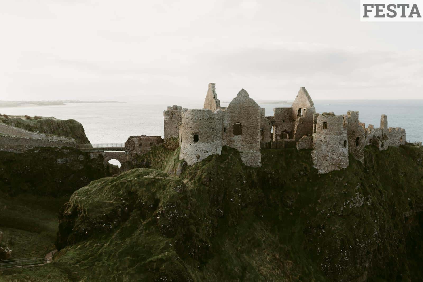 Explore the captivating ruins of Dunluce Castle overlooking the sea in Northern Ireland.